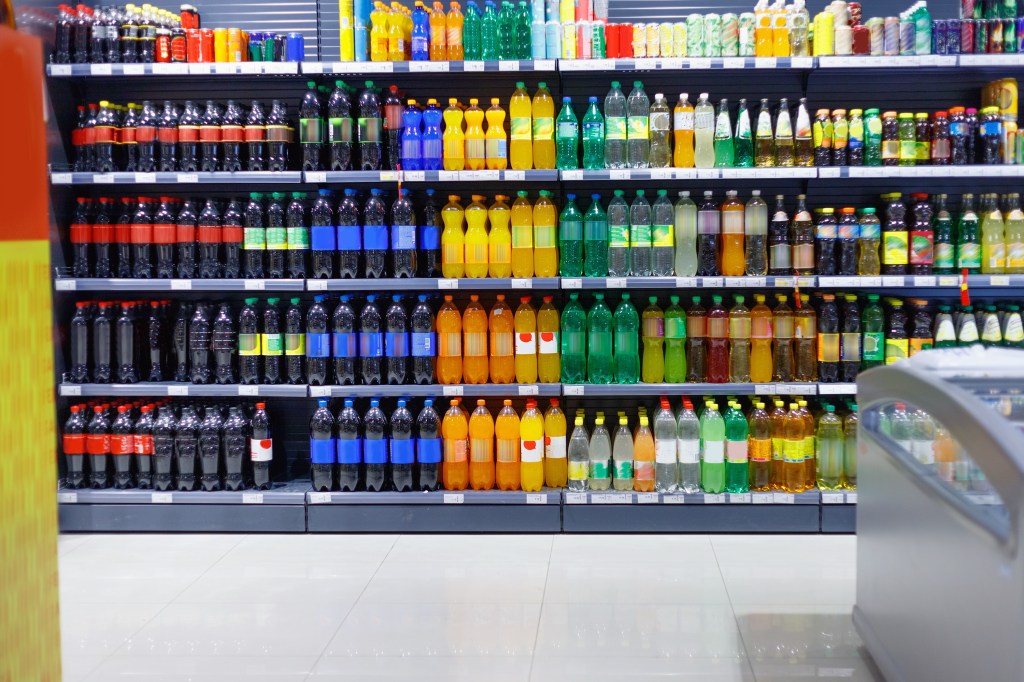 drinks on a shelf including some from small and medium-sized businesses
