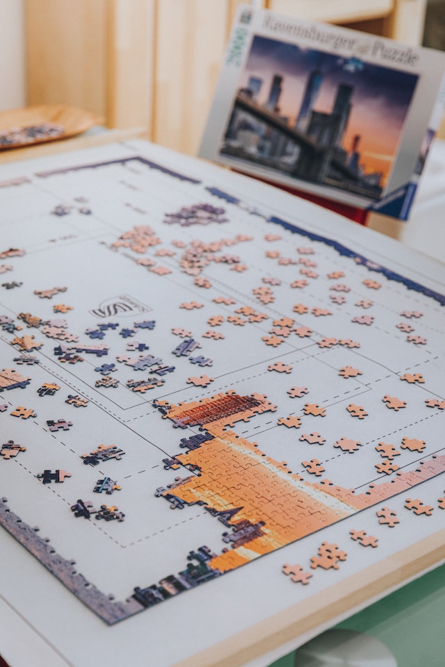 An unfinished puzzle with many pieces missing in the middle.