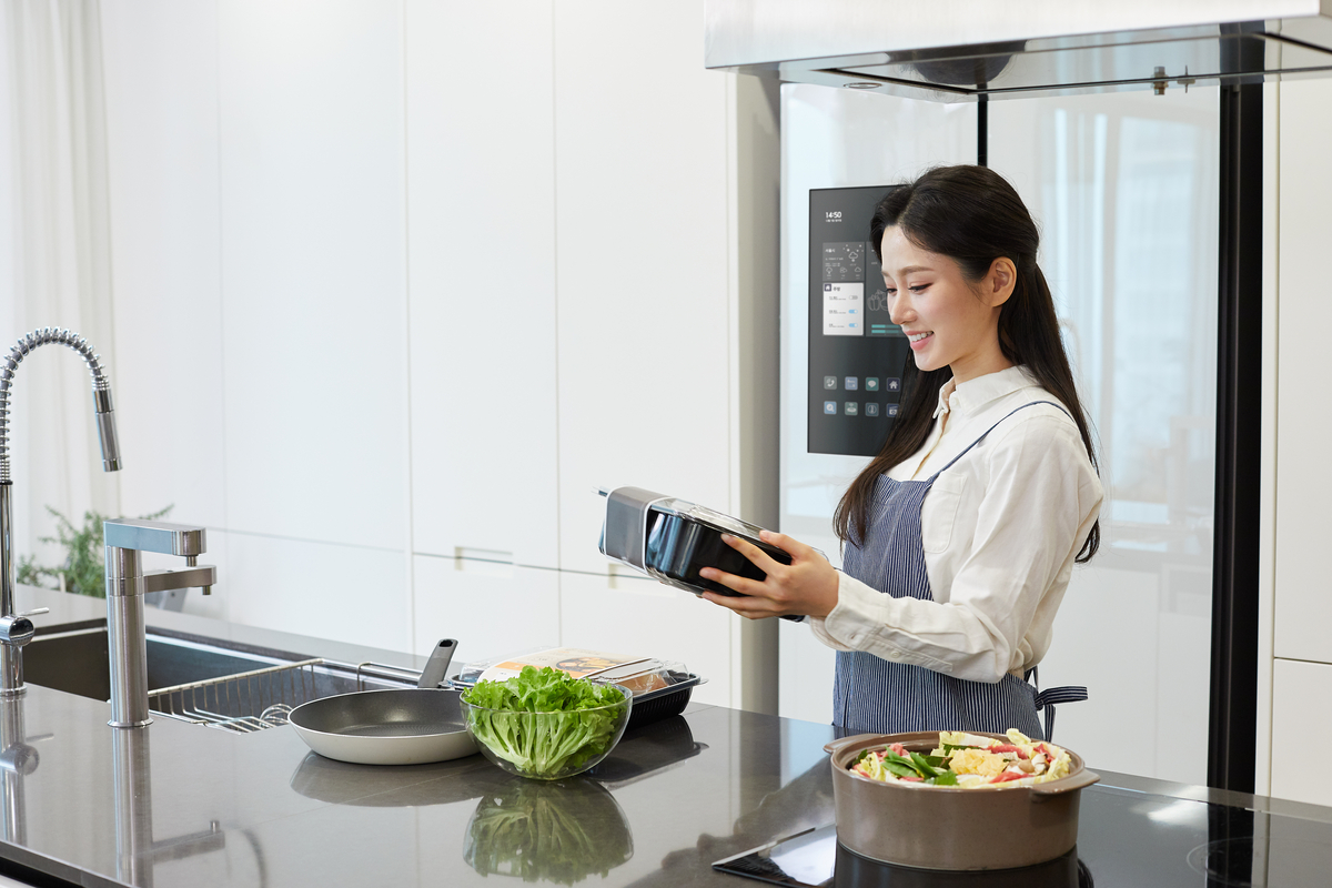 Smiling Woman Bringing a Meal Kit