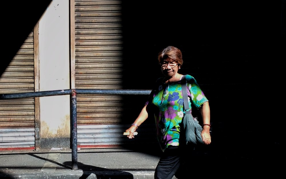 filipino woman walking on street