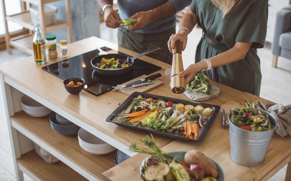 couple cooking healthy meal together