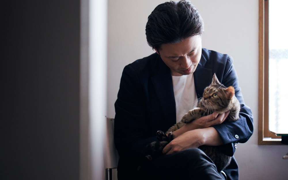 man holding cat