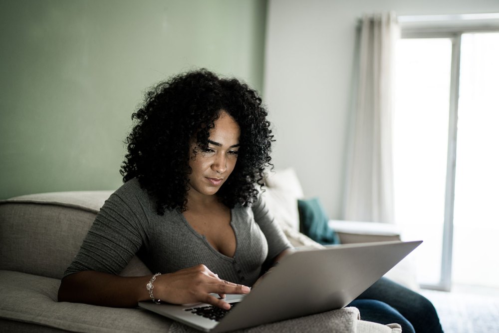 Woman looking at laptop