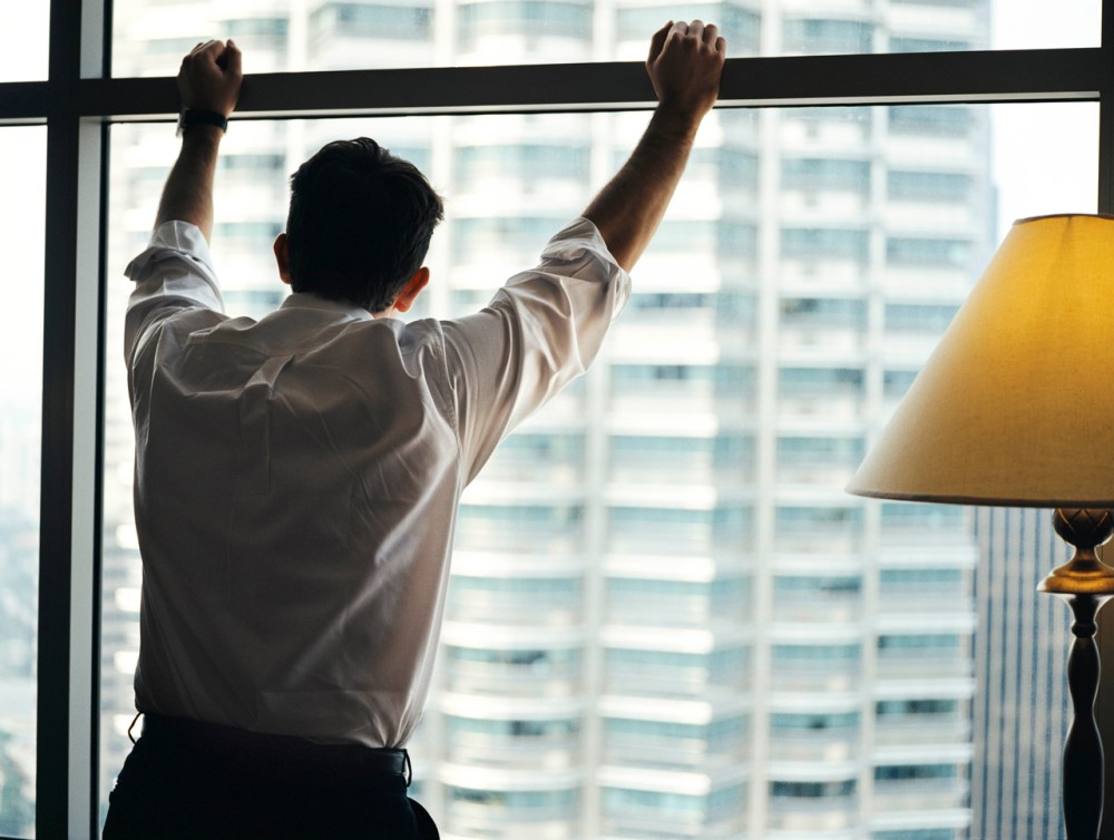 Businessman looking out window