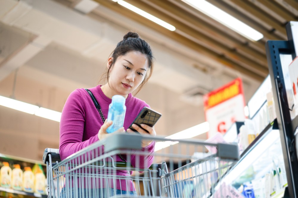 asian female shopping in supermarket