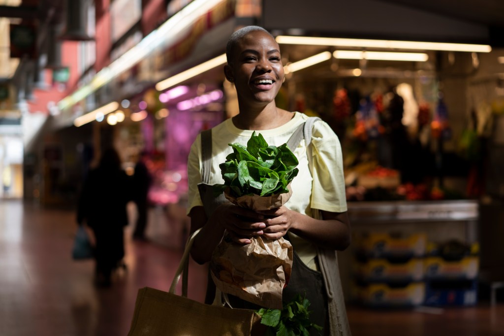 Barcelona, Spain. Young cool woman shoping in local market. Sustainable, local, grocery store, buy, reusable, vegetables, fruit, recycle, healthy, local, small business