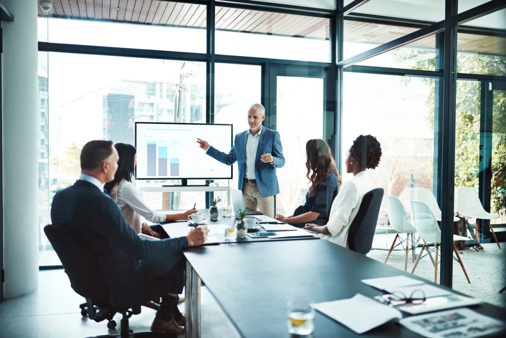 Cropped shot of a businessman giving a presentation in a boardroom meeting