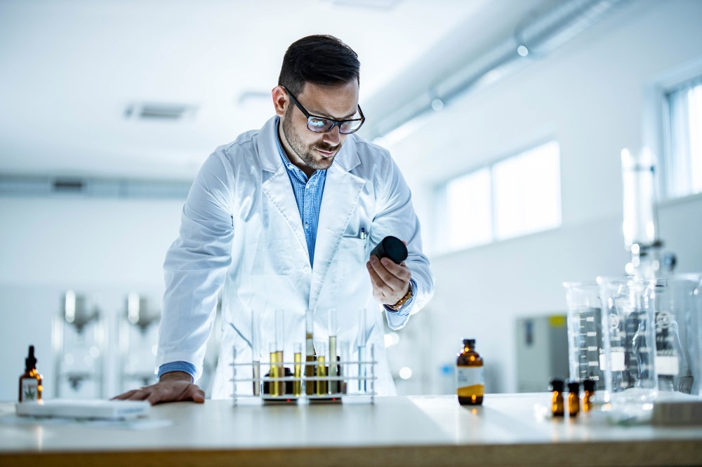 A male scientist in the lab beginning the process of creating lab-grown food.