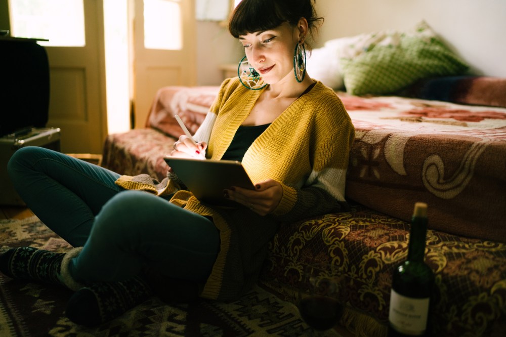 Woman using tablet to search for products on a Turkey e-commerce website