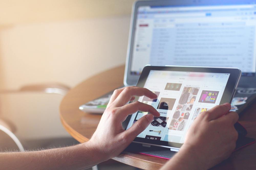 a woman's hand looking at products online