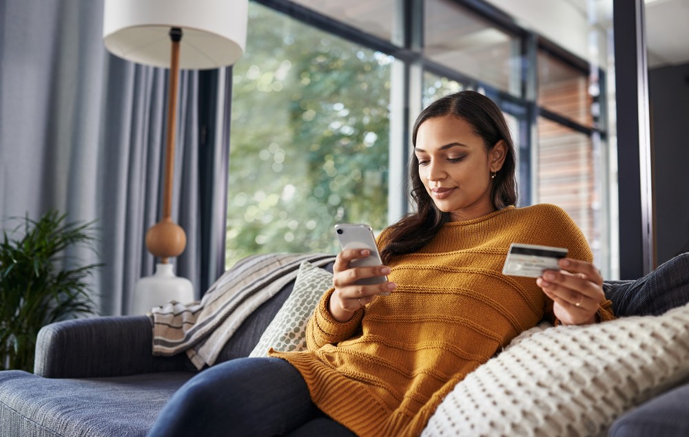 Woman reviews product information while online shopping