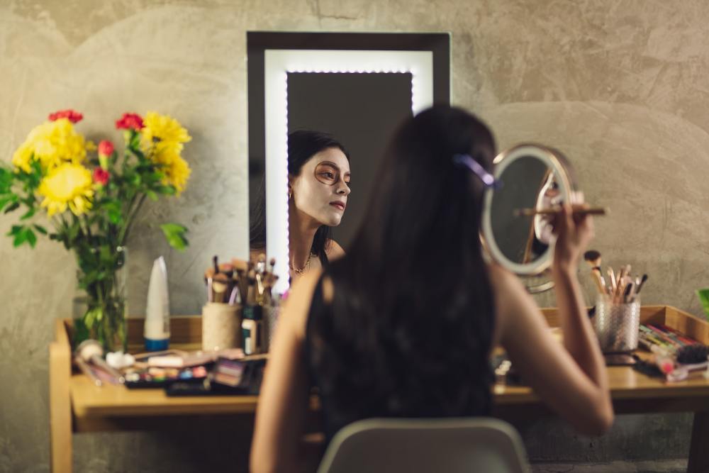 Woman applying halloween makeup trend