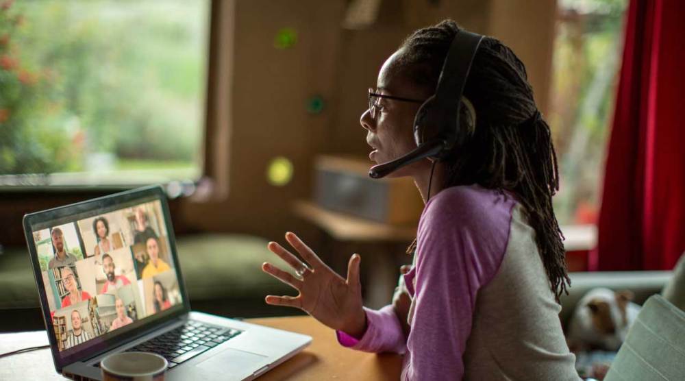 Woman with headset in an online meeting