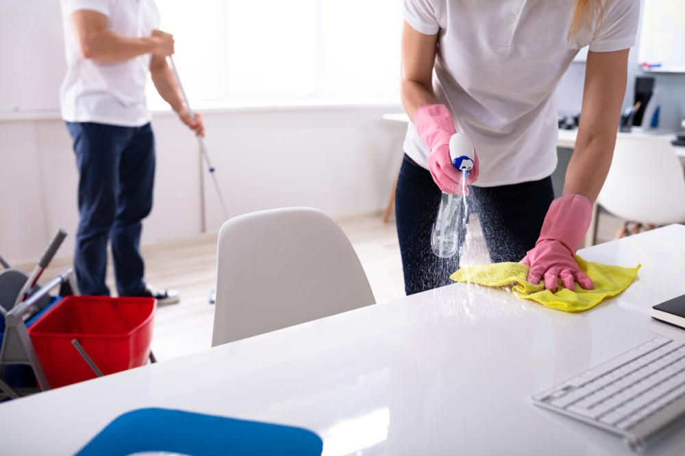 A couple cleaning their home.
