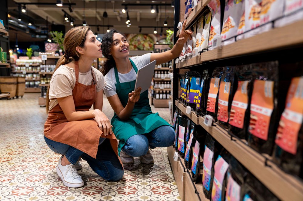 Two clerks in a store taking inventory