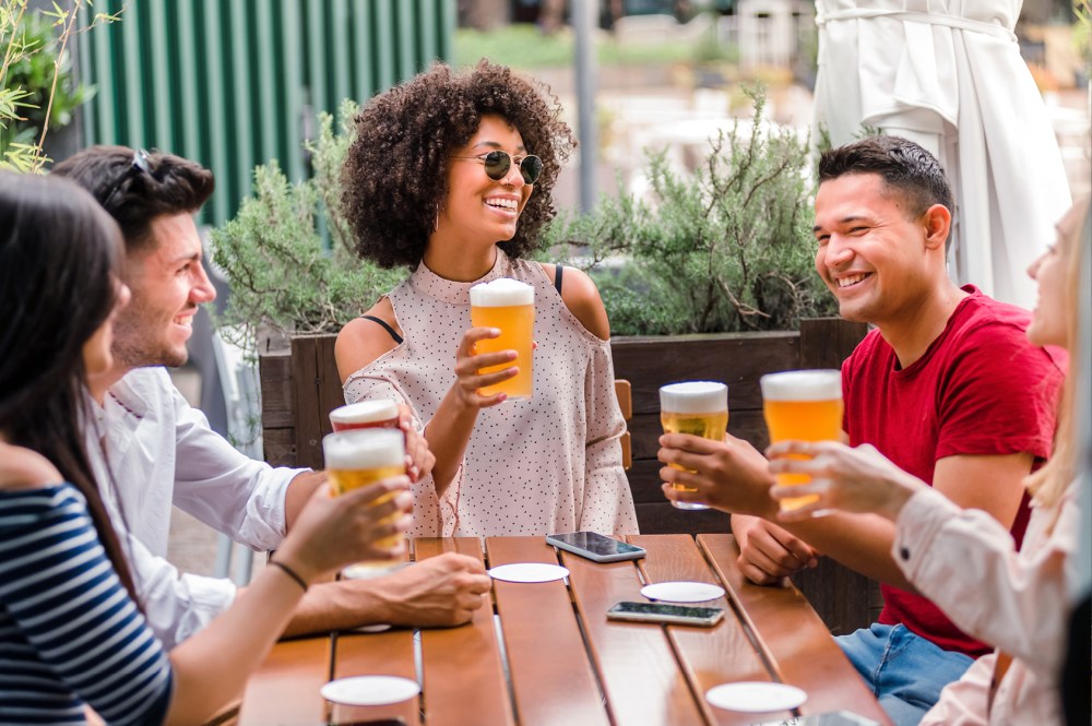 On Premise consumers drinking beer around a picnic table