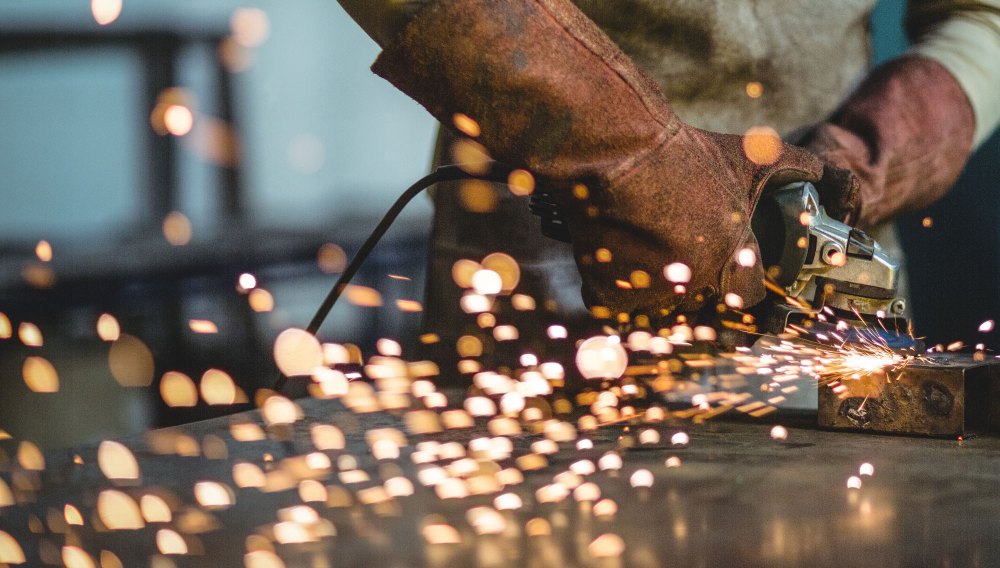 Worker grinding in the industry