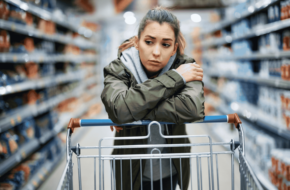 sad girl in a supermarket