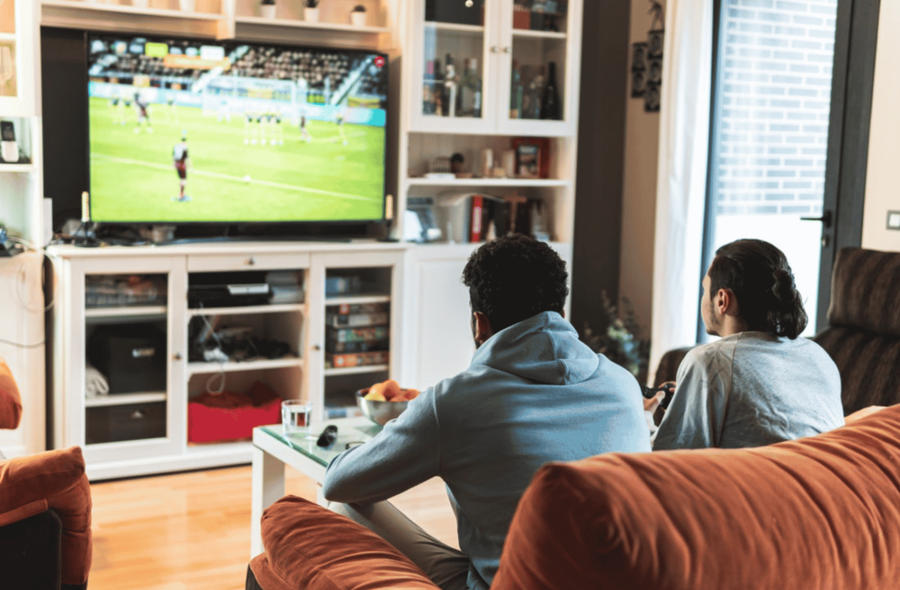 man playing soccer videogames