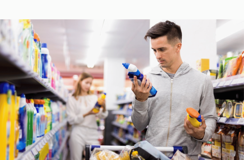 man in a supermarket with cleaning products