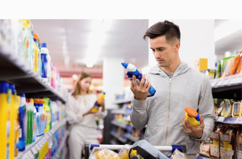 man in a supermarket with cleaning products