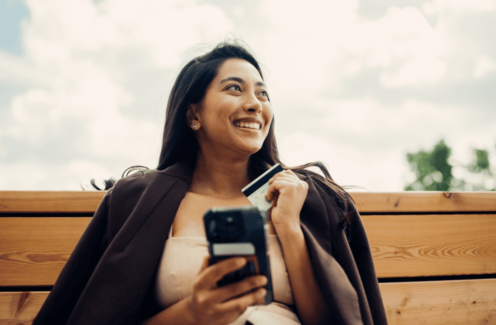 women with her phone buying beauty products